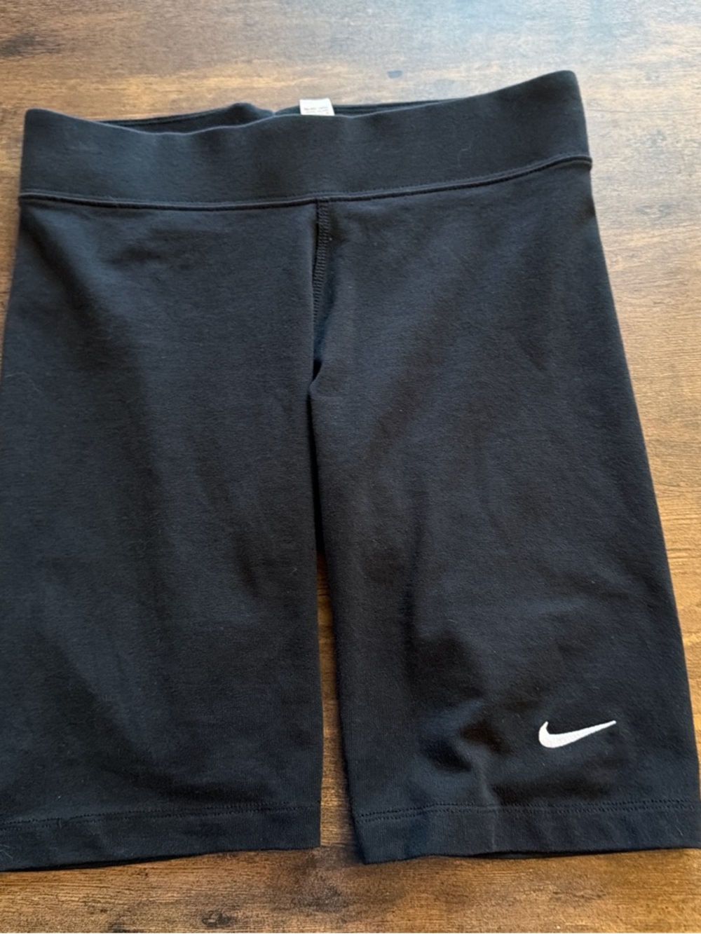 Nike Black Athletic Shorts with White Swoosh Print